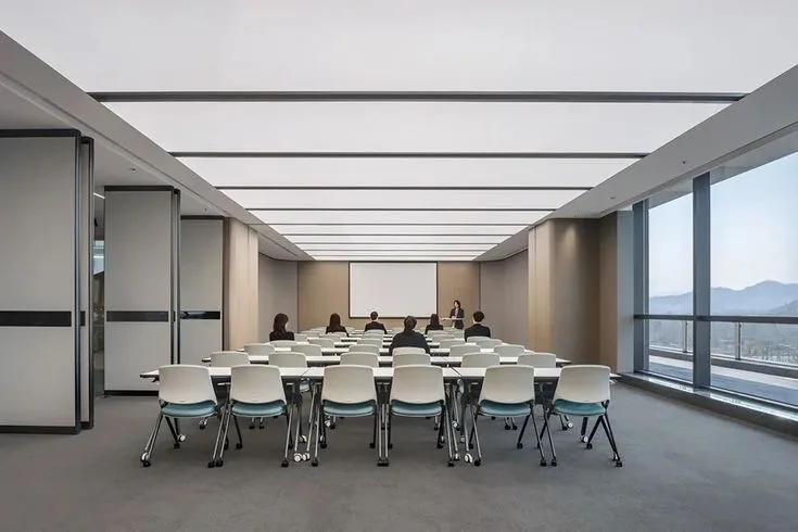 A school multipurpose hall divided by an operable wall into two classrooms